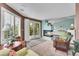 Open floor plan with a fireplace, and sliding glass door access to the deck at 6681 Flintwood Rd, Parker, CO 80138