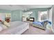 Primary bedroom with fireplace, carpet, lounge, and forest views at 6681 Flintwood Rd, Parker, CO 80138