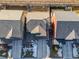 Aerial view showcasing a cluster of townhouses with gray and red roofs at 15792 E Otero Cir, Centennial, CO 80112