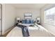 Spacious bedroom with a king-size bed and ample natural light at 15792 E Otero Cir, Centennial, CO 80112