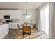 Kitchen dining area with round table and four leather chairs at 15792 E Otero Cir, Centennial, CO 80112