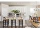 Modern kitchen with white cabinets and granite countertops at 15792 E Otero Cir, Centennial, CO 80112