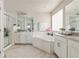 Main bathroom with double vanity, soaking tub, and shower at 15792 E Otero Cir, Centennial, CO 80112