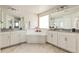 Main bathroom with double vanity, soaking tub, and separate shower at 15792 E Otero Cir, Centennial, CO 80112