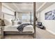 Main bedroom with a four-poster bed and large windows at 15792 E Otero Cir, Centennial, CO 80112