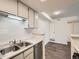 Well-lit kitchen with stainless steel appliances, modern finishes, and a functional design at 14131 E Jewell Ave # 104, Aurora, CO 80012