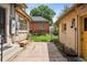 Backyard space with brick walkway and lush garden beds at 2975 Irving St, Denver, CO 80211