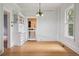 Bright dining room with hardwood floors, a charming chandelier, and built-in shelving at 2975 Irving St, Denver, CO 80211