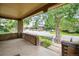 Spacious covered front porch with brick columns, offering a view of the neighborhood street at 2975 Irving St, Denver, CO 80211