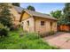 Charming detached garage with brick exterior and lush greenery at 2975 Irving St, Denver, CO 80211