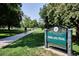 A scenic view of Highland Park featuring the sign and the lush green landscape on a sunny day at 2975 Irving St, Denver, CO 80211
