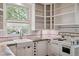 Kitchen featuring concrete countertops, white subway tile backsplash and vintage style stove at 2975 Irving St, Denver, CO 80211