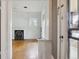 Bright living room with hardwood floors, fireplace, stained glass window, and view towards entryway at 2975 Irving St, Denver, CO 80211