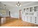 Spacious living room featuring hardwood floors, a ceiling fan and a vintage-style built-in buffet at 2975 Irving St, Denver, CO 80211