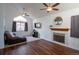 Bright living room with vaulted ceilings, wood floors, and a cozy fireplace at 3342 W 114Th Pl, Westminster, CO 80031