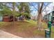 Green lawn with trees surround a community, showing well-maintained outdoor space and decks at 3546 S Depew St # 103, Denver, CO 80235