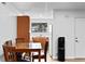 Kitchen and Dining area featuring a table with four chairs and wood-style flooring at 3546 S Depew St # 103, Denver, CO 80235