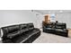 Bright living room showcasing plush seating and open access to the kitchen area at 3546 S Depew St # 103, Denver, CO 80235