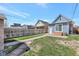Spacious backyard with brick paver pathway and patio, perfect for outdoor entertaining at 4036 Navajo St, Denver, CO 80211
