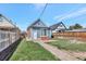 Charming backyard with new landscaping, a brick paver patio, and a cozy atmosphere at 4036 Navajo St, Denver, CO 80211