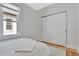 Bedroom featuring a window, closet, and hardwood floors at 4036 Navajo St, Denver, CO 80211