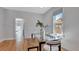 Dining room with glass table and seating offering an open floorplan layout with hardwood flooring at 4036 Navajo St, Denver, CO 80211