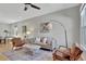 Comfortable living room area featuring neutral decor, a ceiling fan, and lots of natural light at 4036 Navajo St, Denver, CO 80211