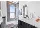 Contemporary bathroom features a shower-tub combo and a modern vanity at 4950 Lowell Blvd, Denver, CO 80221