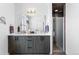 Modern bathroom features a dual sink vanity and a frameless glass shower at 4950 Lowell Blvd, Denver, CO 80221