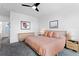 Inviting bedroom featuring neutral tones, comfortable bed, and artwork, creating a cozy and relaxing space at 4950 Lowell Blvd, Denver, CO 80221