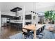 Dining area with modern light fixtures and large windows providing an abundance of natural light at 4950 Lowell Blvd, Denver, CO 80221
