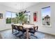 Bright dining room featuring natural light, modern decor, and stylish design with large windows at 4950 Lowell Blvd, Denver, CO 80221