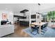 Open-concept layout seamlessly connects dining area to the modern kitchen, perfect for entertaining at 4950 Lowell Blvd, Denver, CO 80221