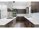 Modern kitchen featuring an island with a gas stovetop, premium appliances, and generous counter space at 4950 Lowell Blvd, Denver, CO 80221