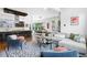 Open-concept layout of the living room, dining area, and kitchen creates an inviting and spacious atmosphere at 4950 Lowell Blvd, Denver, CO 80221