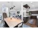 Inviting living space with a fireplace, wood floors, and an open layout to the kitchen at 4950 Lowell Blvd, Denver, CO 80221
