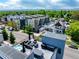Enjoy the outdoors with a rooftop deck with a firepit, seating, BBQ grill, outdoor kitchen, hot tub and views of mountains at 4950 Lowell Blvd, Denver, CO 80221