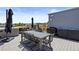 Spacious rooftop deck with outdoor dining, grill area, and a hot tub at 4950 Lowell Blvd, Denver, CO 80221
