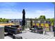 Expansive rooftop deck offering ample seating, a dining area, and neighborhood views at 4950 Lowell Blvd, Denver, CO 80221