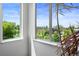 Window view of a lush green backyard, a perfect backdrop for relaxation and enjoyment of nature at 4950 Lowell Blvd, Denver, CO 80221