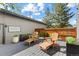 Cozy back deck with gray stained wood, string lights and privacy fence at 2107 S Grant St, Denver, CO 80210
