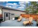 Backyard deck with chairs and string lights at 2107 S Grant St, Denver, CO 80210
