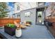 Backyard deck with chairs and string lights at 2107 S Grant St, Denver, CO 80210