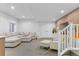 Inviting basement with plush carpet, contemporary sectional, and stylish decor at 2107 S Grant St, Denver, CO 80210