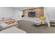 Finished basement featuring a sleek entertainment center and comfortable seating at 2107 S Grant St, Denver, CO 80210