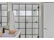 Elegant bathroom showcasing a modern black-framed glass shower enclosure and neutral color palette at 2107 S Grant St, Denver, CO 80210