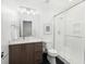 Bathroom featuring a glass shower, modern vanity, and tile flooring at 2107 S Grant St, Denver, CO 80210