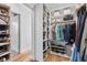 Spacious walk-in closet featuring custom shelving, shoe storage, and ample room for organized storage at 2107 S Grant St, Denver, CO 80210