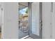 Inviting front porch showcases modern chairs, sleek railing, and clear glass door to the entry at 2107 S Grant St, Denver, CO 80210