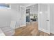 Hallway view showcases open floor plan with glass french doors to an adjacent living area at 2107 S Grant St, Denver, CO 80210